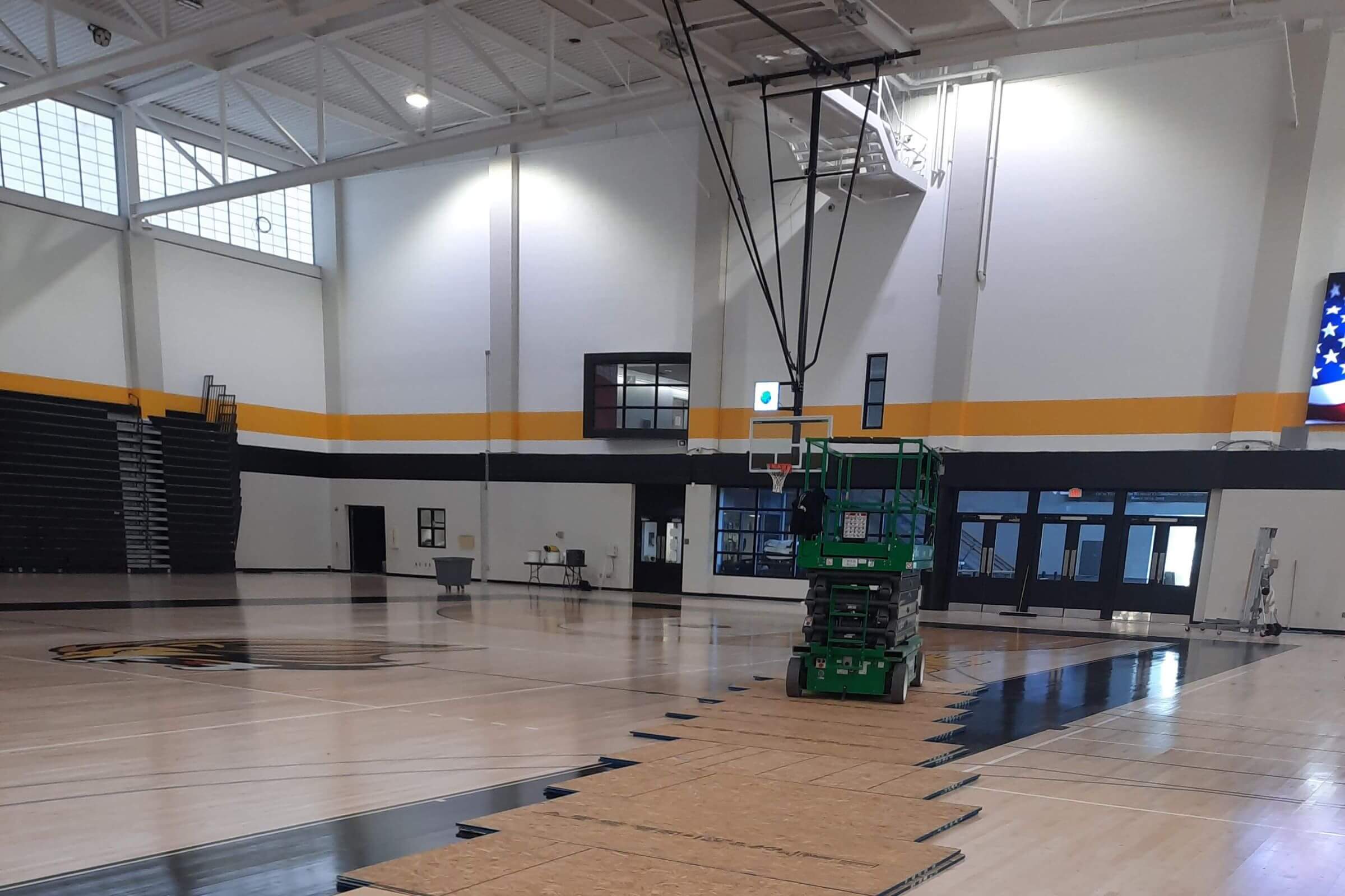 Education 300 A school gymnasium with a boom lift.