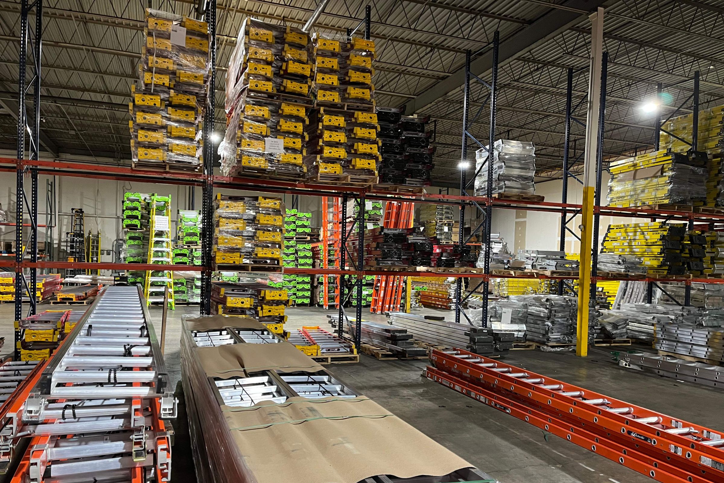 A large warehouse with ladders