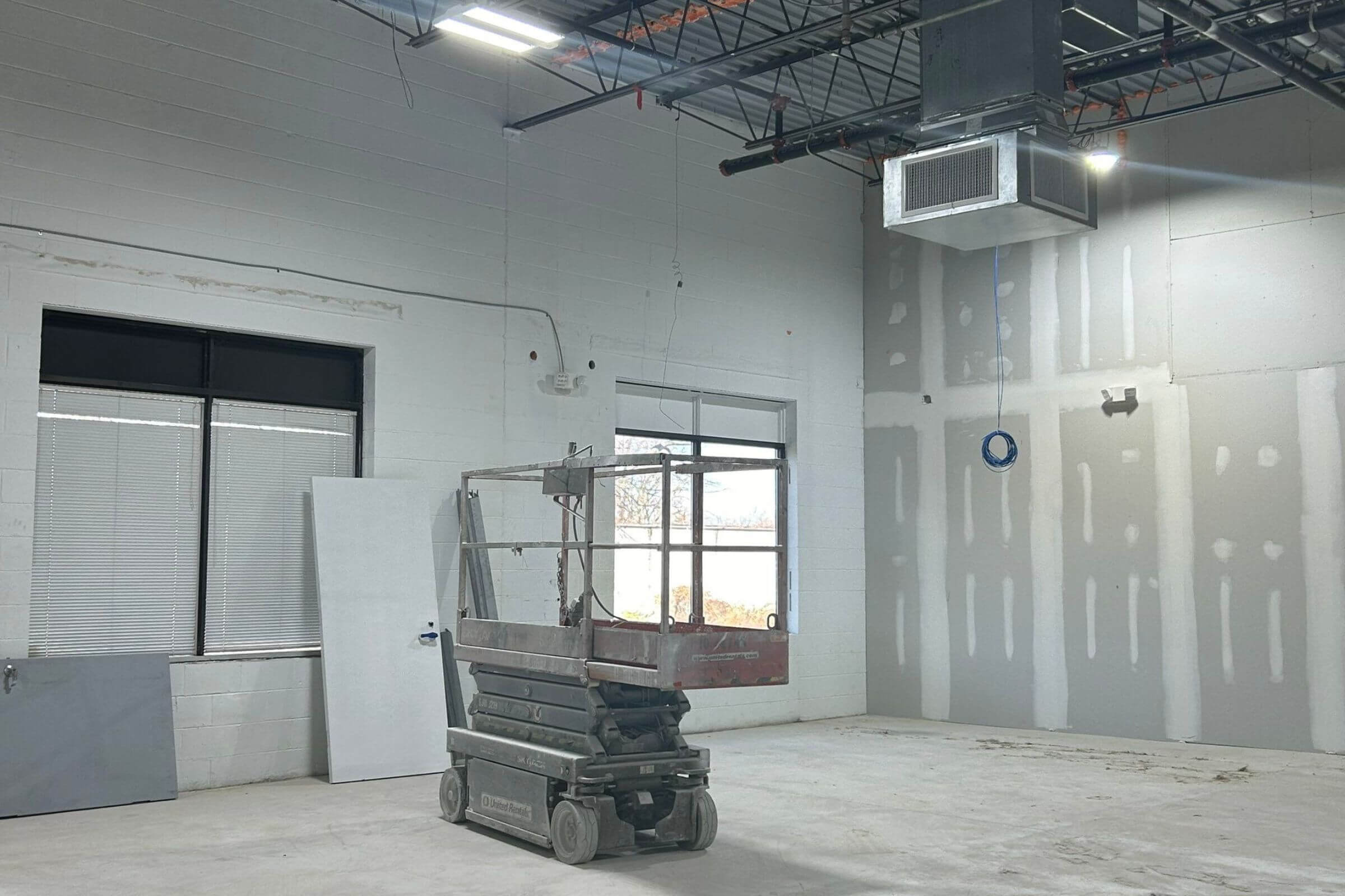 New construction site with a boom lift