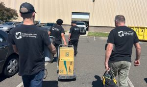 The Truth About Data Center Security and AWS Blackout 2 four network cabling techs with supplies for the job site