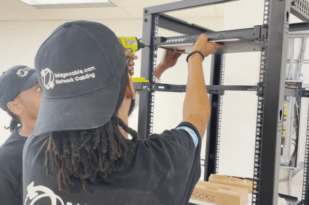 Data Center Network Cabling – Mount Laurel, NJ 2 Technician Working on Network Rack in Mount Laurel, NJ Data Center