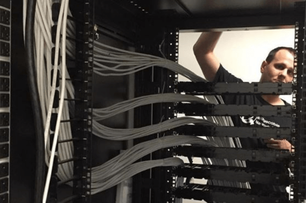 Data Center Network Cabling – Lansdale, PA 2 Technician working on structured cabling in a Morrisville, PA data center