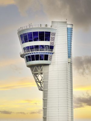RF Interference Challenges During Network Cabling Installs Near Major Airports Like Philadelphia International 2 Air traffic control tower at Philadelphia International Airport during sunset with communication equipment visible.