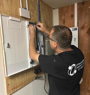 How Different Biometric Devices Improve Modern Access Control Systems 2 Bridge Cable technician working on commercial access control and network cabling infrastructure.