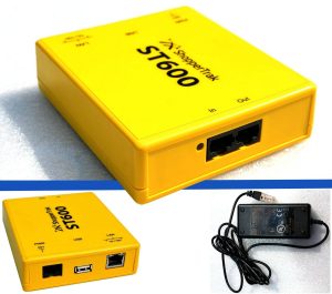 How ShopperTrak Solutions Improve Retail Performance 2 Yellow ShopperTrak ST600 retail traffic counting device with network, USB, and power connections alongside its power adapter.
