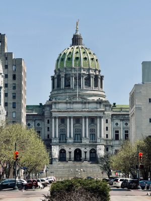 Discover Why Companies Upgrade Ethernet Cabling Harrisburg PA 4 Front view of the Pennsylvania State Capitol building in Harrisburg with its green dome, columned facade, and wide entrance staircase.