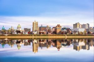 Discover Why Companies Upgrade Ethernet Cabling Harrisburg PA 3 Harrisburg, Pennsylvania city skyline with its reflection on the calm Susquehanna River at twilight.