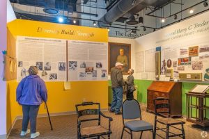 Allentown Structured Cabling Companies: Preparing Networks for Growth 1 Museum visitors viewing historical exhibits including "Diversity Builds Strength" and displays on General Harry C. Trexler at a Lehigh Valley history museum.